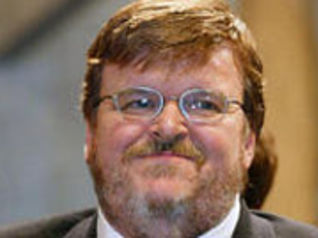 Michael Moore premiato con la Palma d'oro al Festival di Cannes 2004