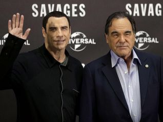 John Travolta e Oliver Stone